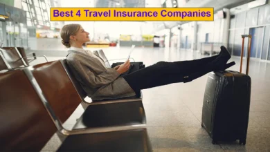 A girl sitting in an airport lounge and stretching her legs over her suitcase