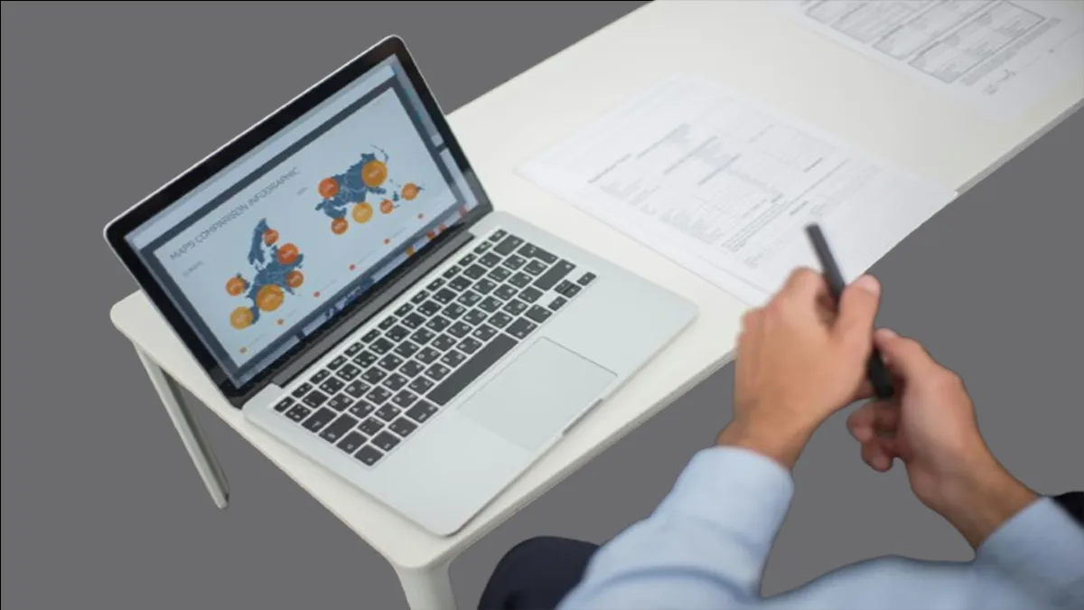 White table with a computer on top of it