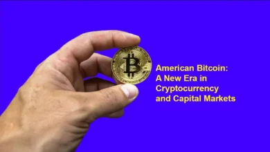 Hand holding bitcoin with blue background
