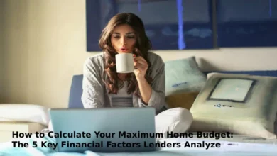 A woman is sitting on the bed, browsing her laptop and holding a mug.